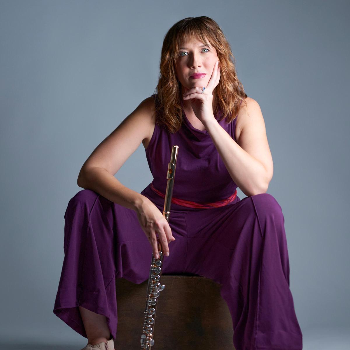 portrait of faculty member meret bitticks holding a flute